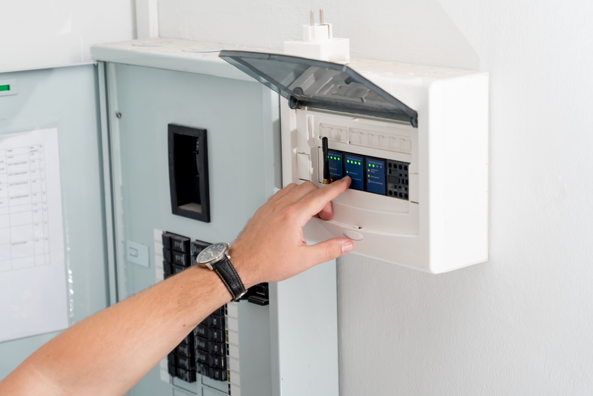 A technician works with a demo kit of the smart home system